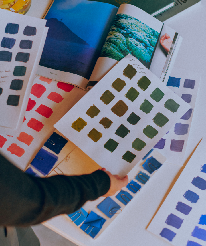 Color palettes (green, brown, red, blue) and fabric swatches, demonstrating textile design and creative inspiration.